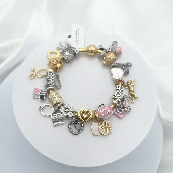 Linx Yellow Gold Bracelet with Gold Silver and Pink Nurse Girlfriend Charms